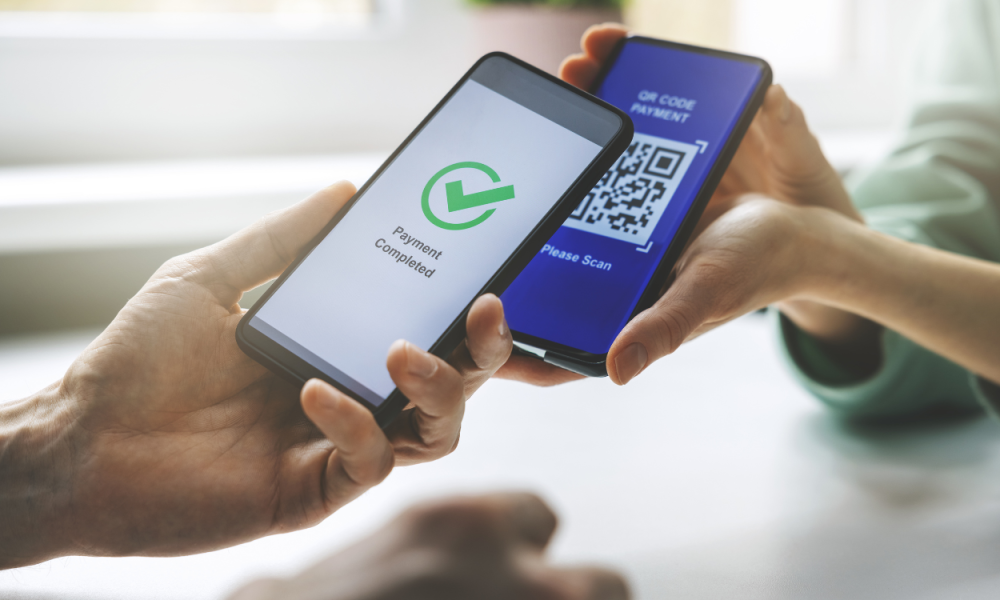 Tak Perlu Scan QR, Kini Pengguna QRIS Bisa Tempelkan Handphone ke Mesin Pembaca untuk Bertransaksi