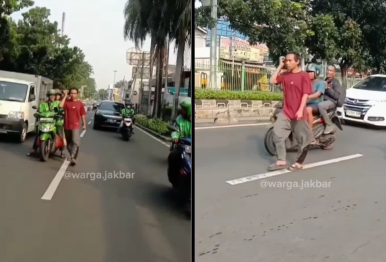 Viral! seorang pria tampak linglung berjalan kaki di tengah jalan raya