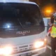Sambut hut ri, sejumlah angkutan barang dipasang bendera merah putih di gerbang tol jakarta